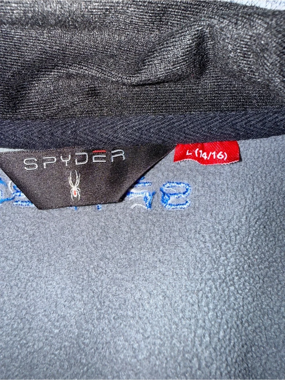 Lot of six graphic tees and one zippered Brand Spyder sweater. Size 14-16